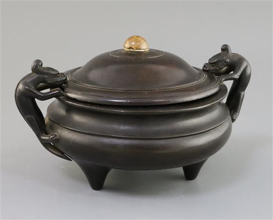 A Chinese bronze tripod censer, ding 18th century W. 25cm, jichimu cover